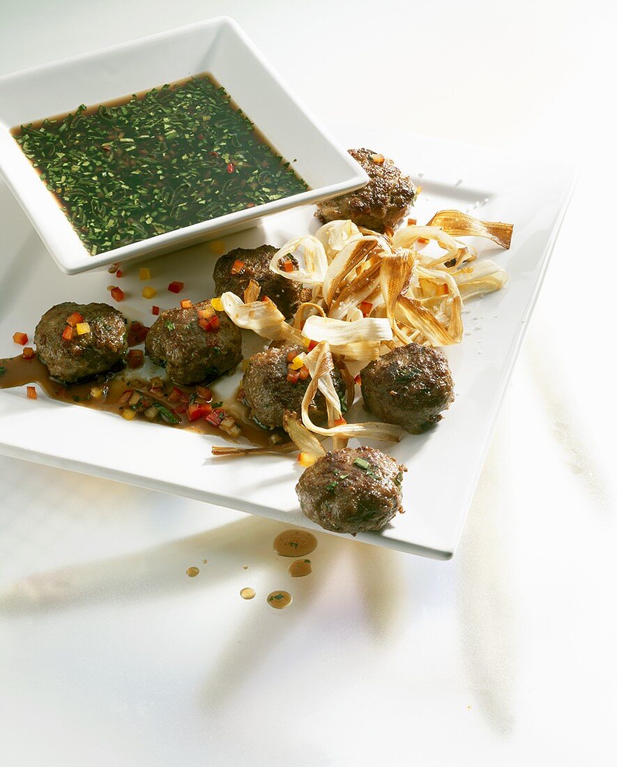 Small meat patties with deep-fried asparagus and soy dip