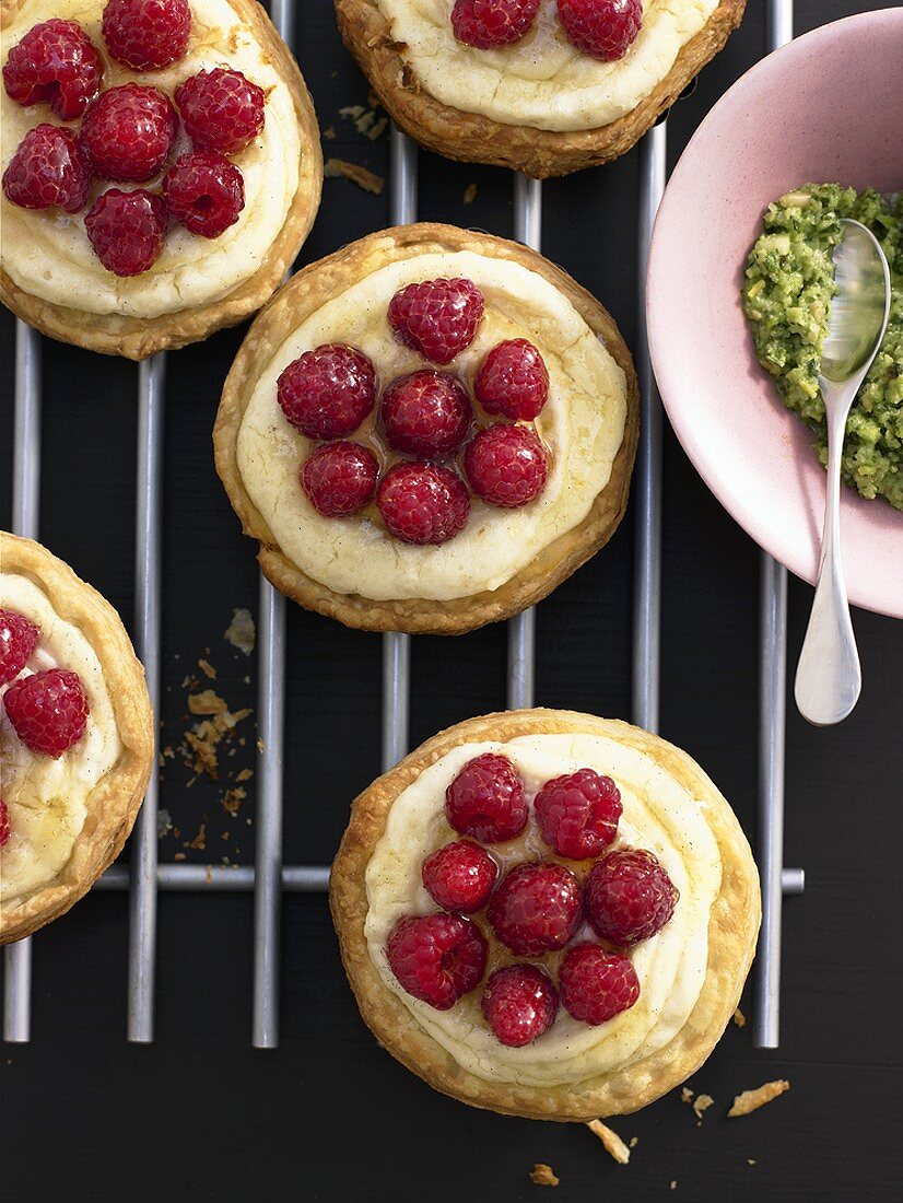 Raspberry semolina tarts on cake rack