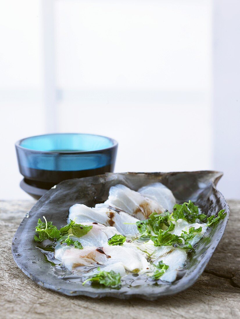 Raw fish fillets with shiso cress
