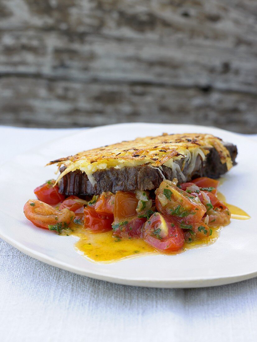 Boiled beef with potato crust and stewed tomatoes