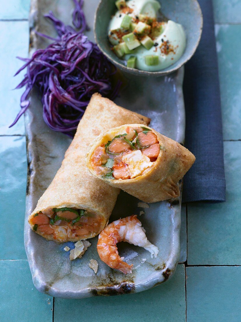 Shrimp & surimi spring roll with red cabbage & avocado cream