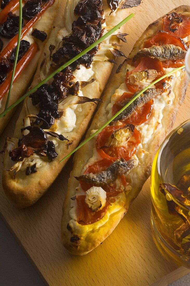 Three different French bread pizzas