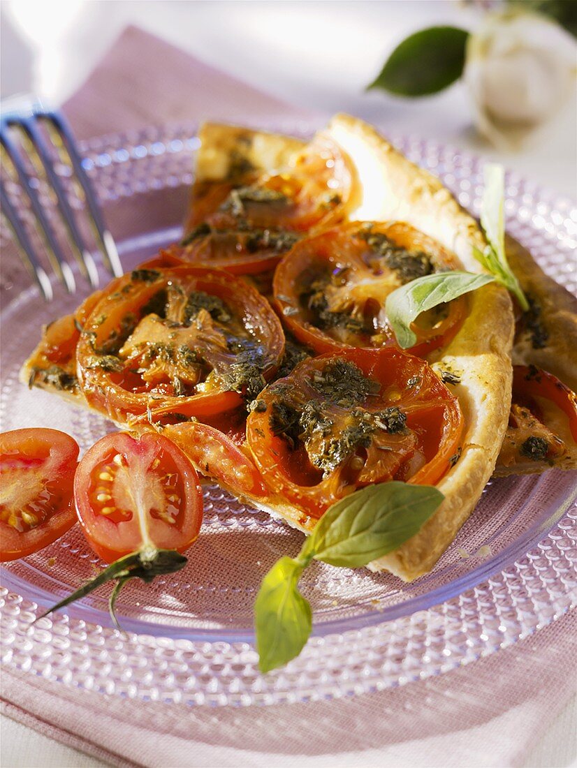 Two pieces of tomato tart with basil