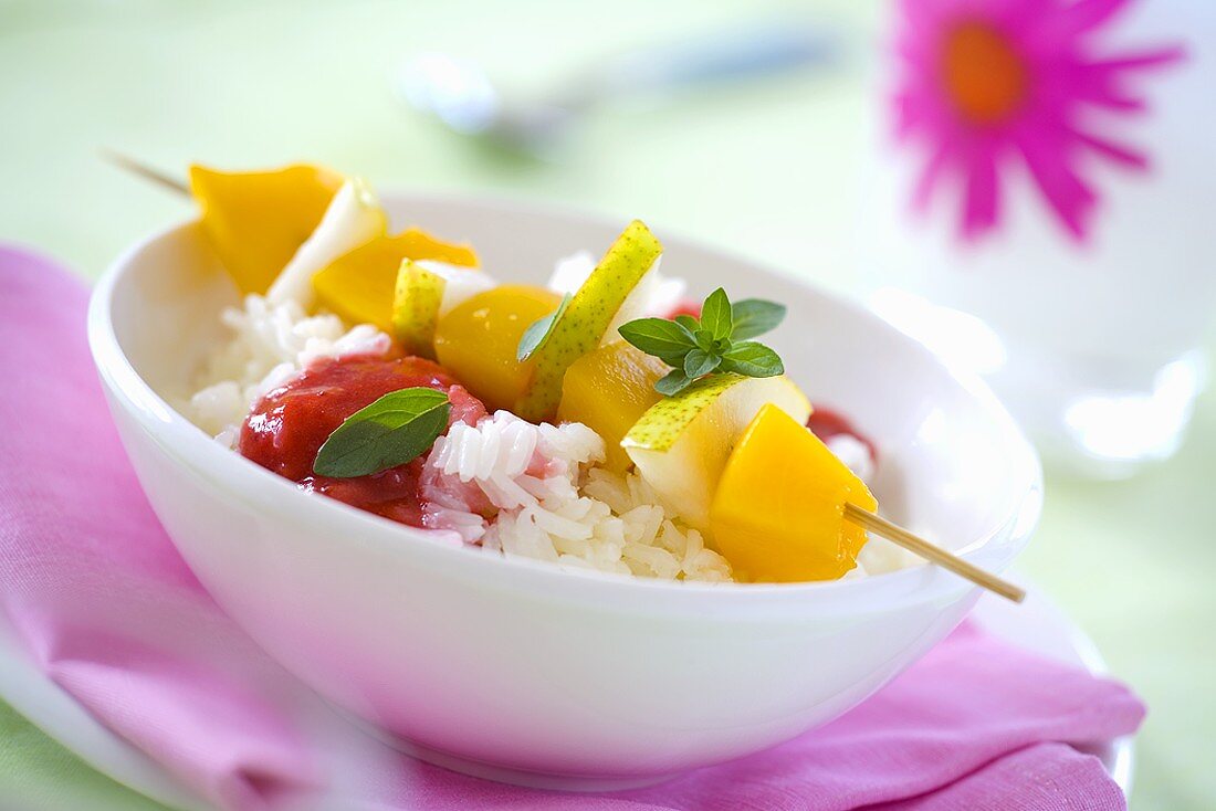 Fruit skewers on rice for children