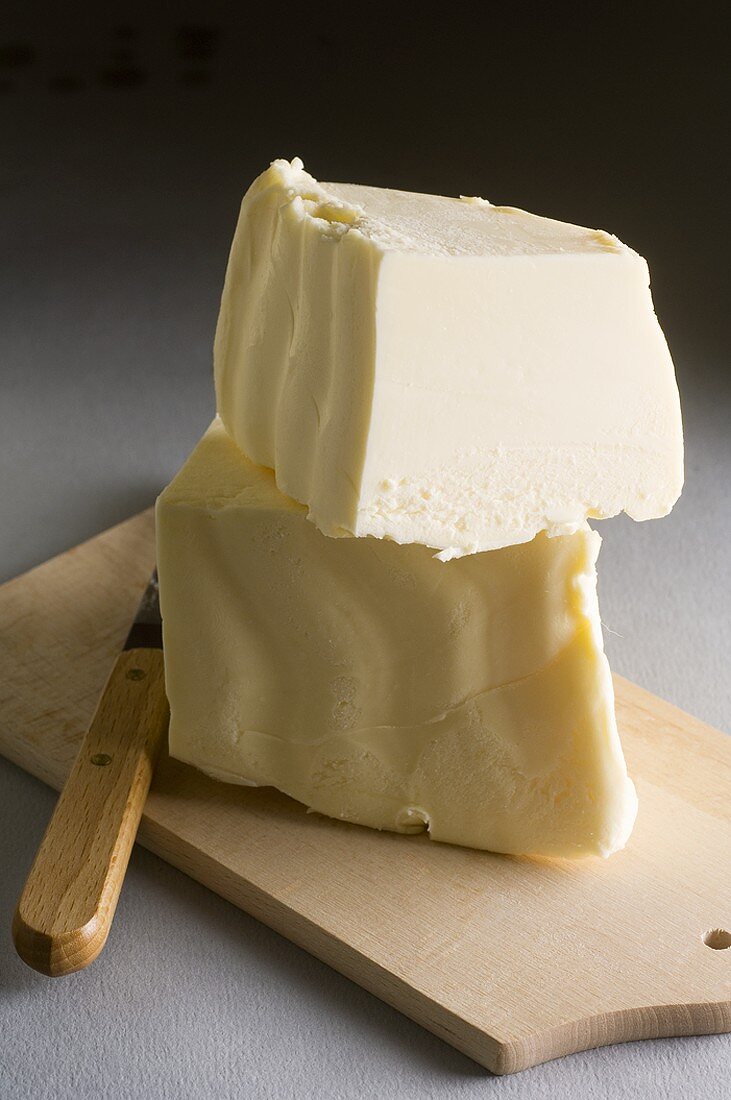 Butter on chopping board with knife