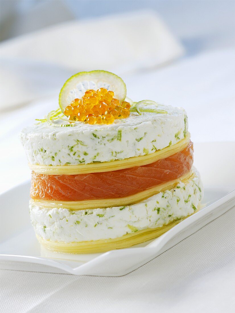 Tower of pastry, salmon & goat's cheese topped with caviar