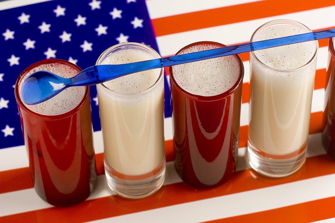 Several milkshakes on American flag