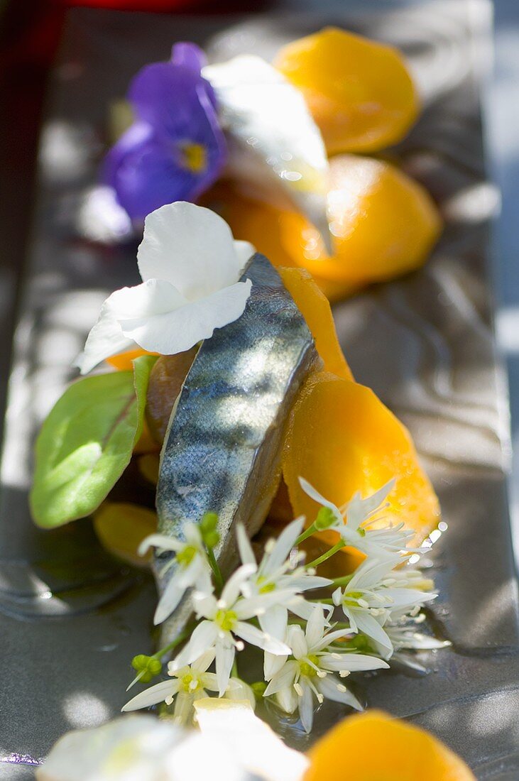 Mackerel with carrots and edible flowers