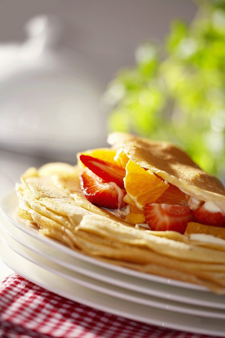 Pancakes with fruit and cream