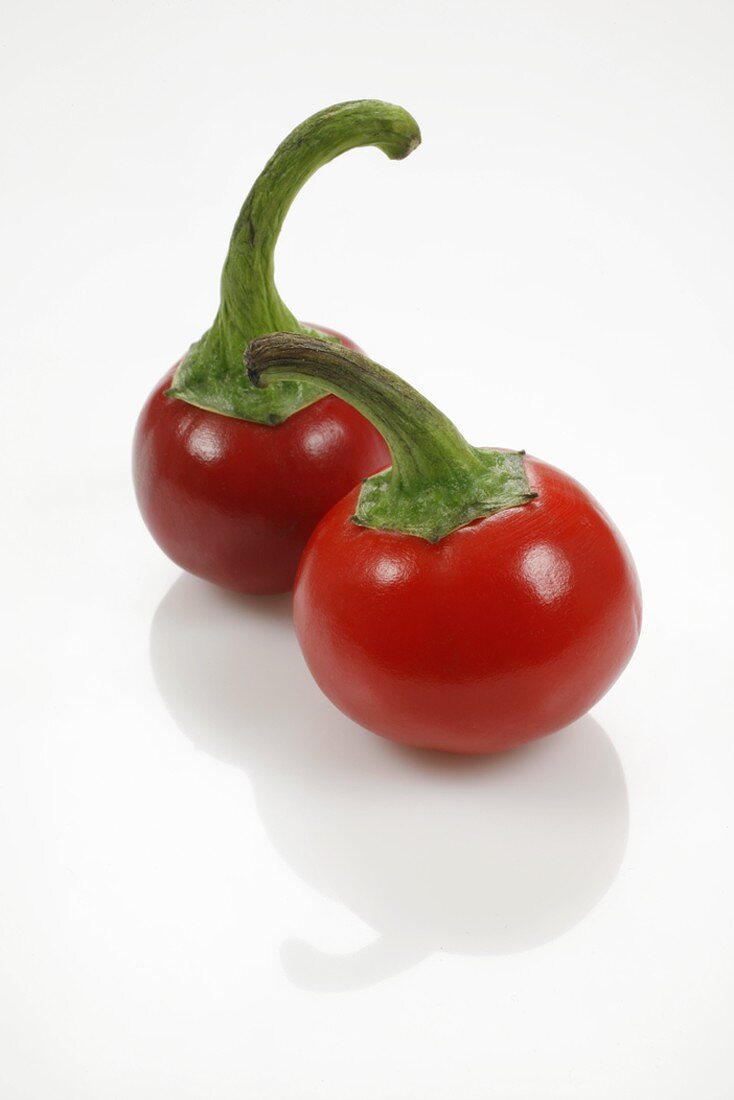 Two cherry peppers