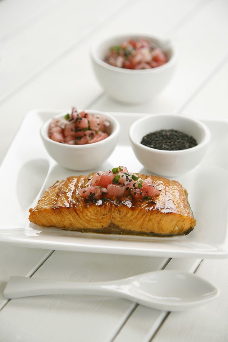 Salmon fillet with watermelon salsa and sesame seeds