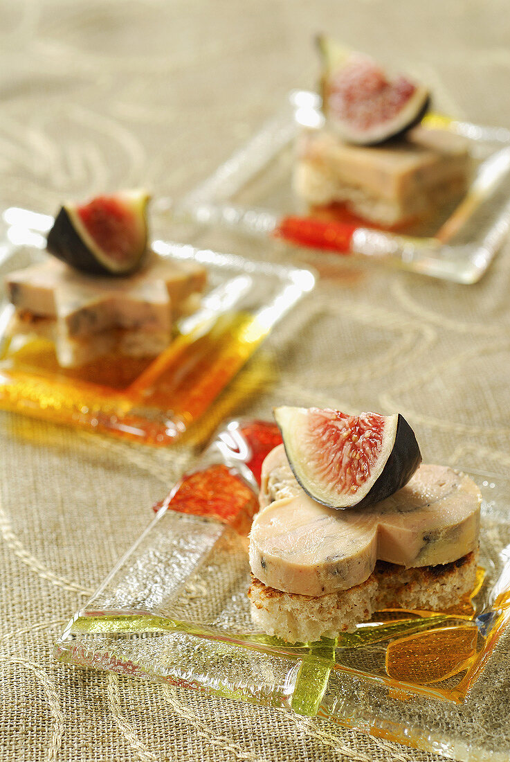 Goose liver canapés topped with fresh figs