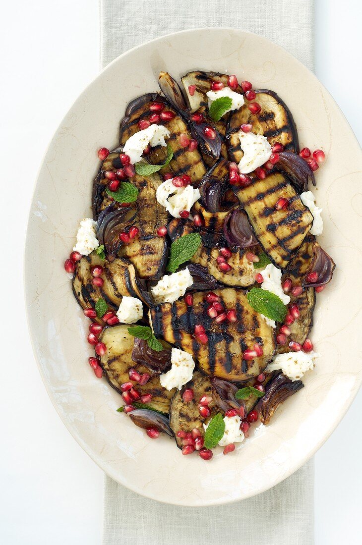 Grilled aubergine with mozzarella and pomegranate seeds