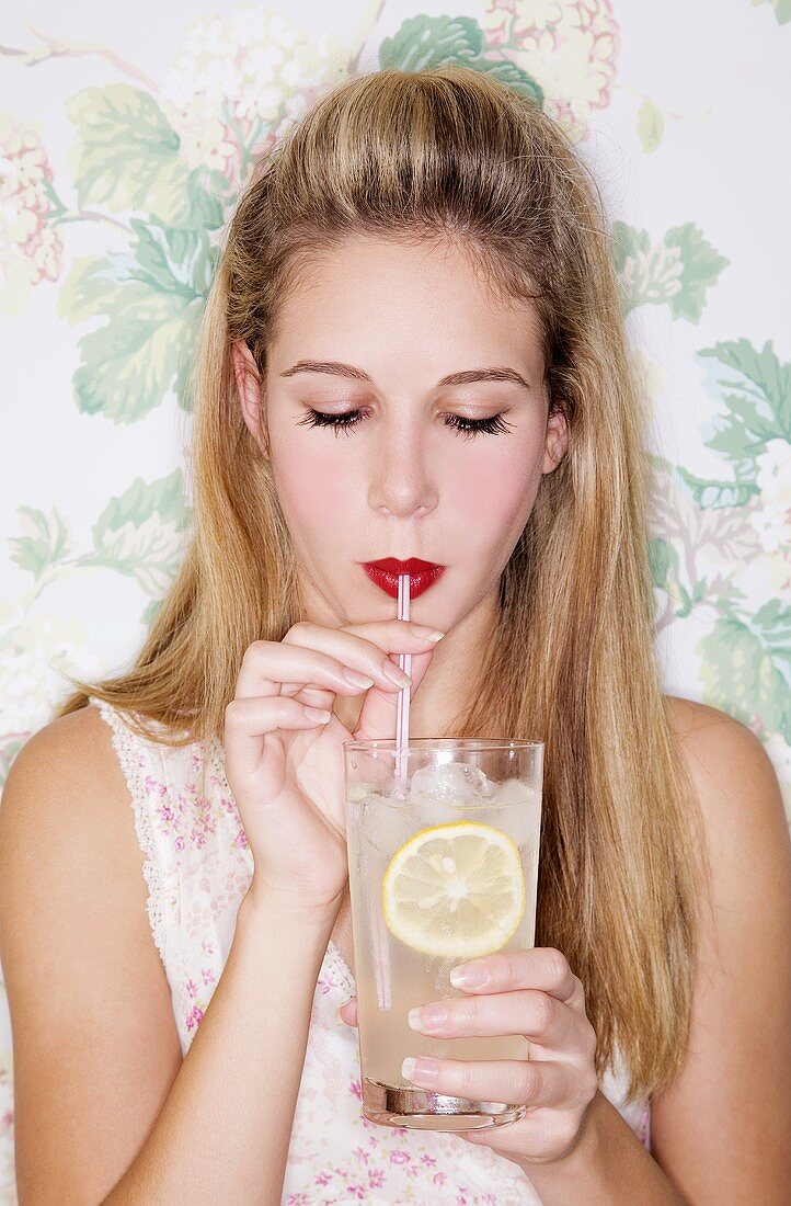 A girl drinking ginger cordial