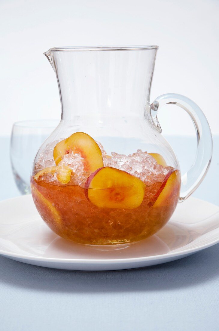 White wine with crushed ice, nectarines and peach slices