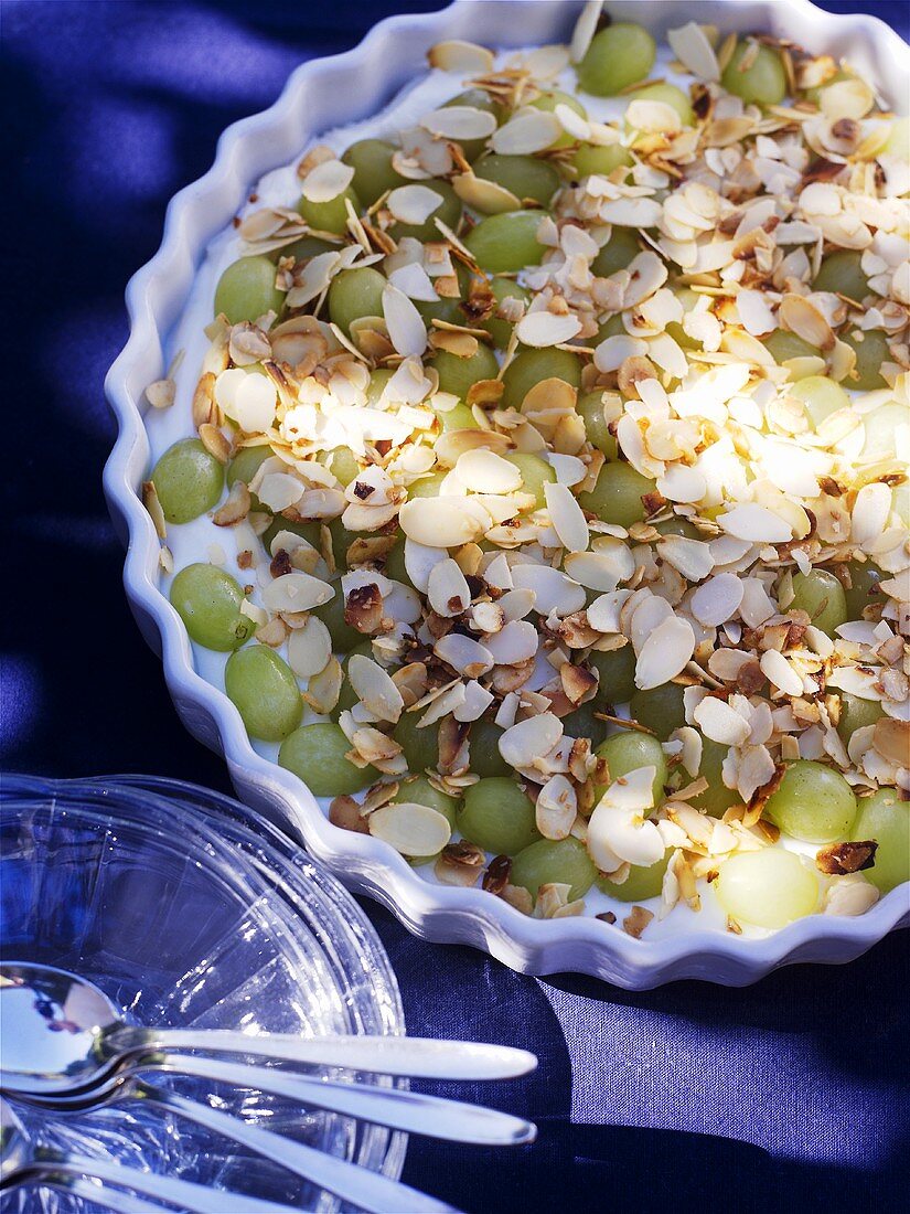 Quark cream with grapes and flaked almonds
