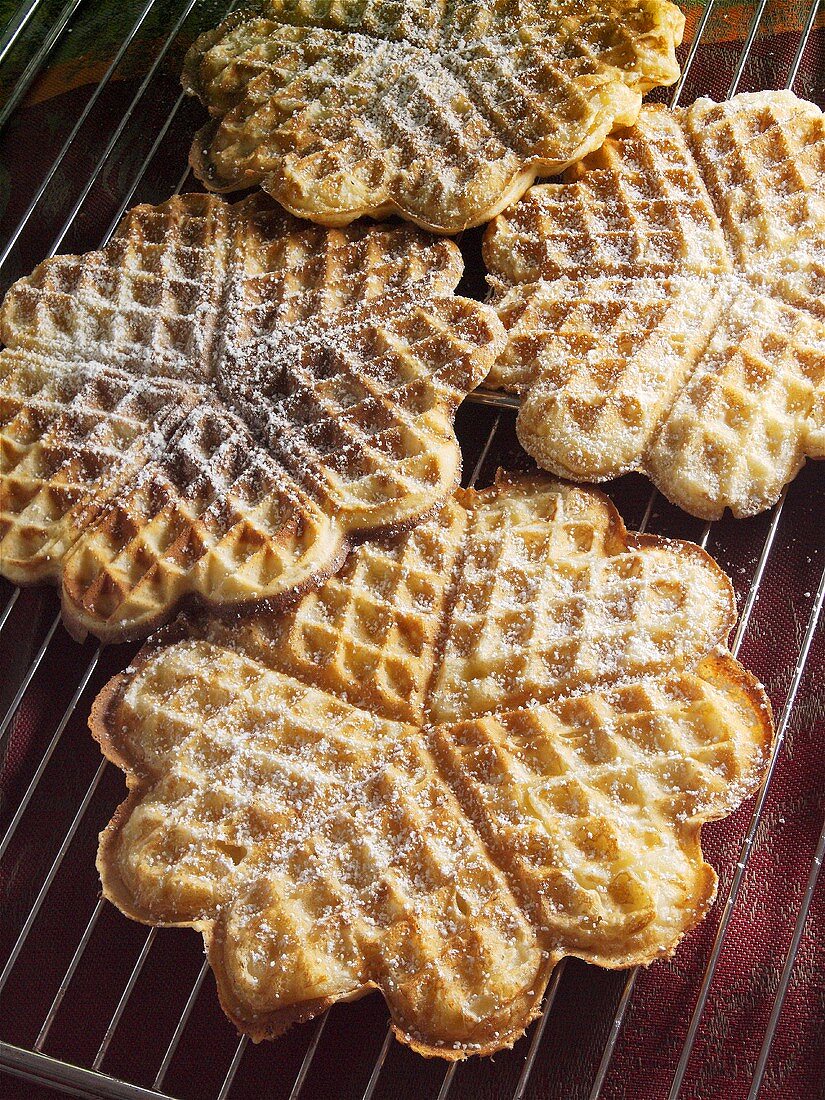 Freshly baked waffles with icing sugar