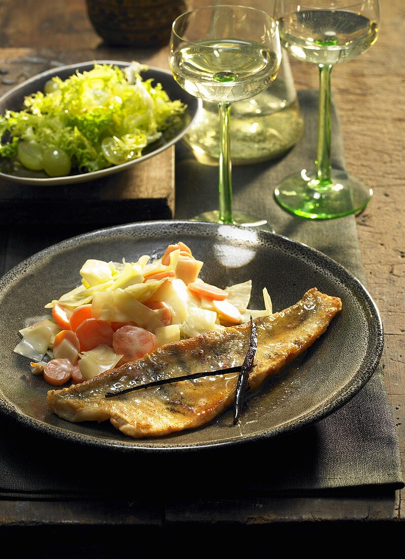 Fried fillet of fish with vegetables