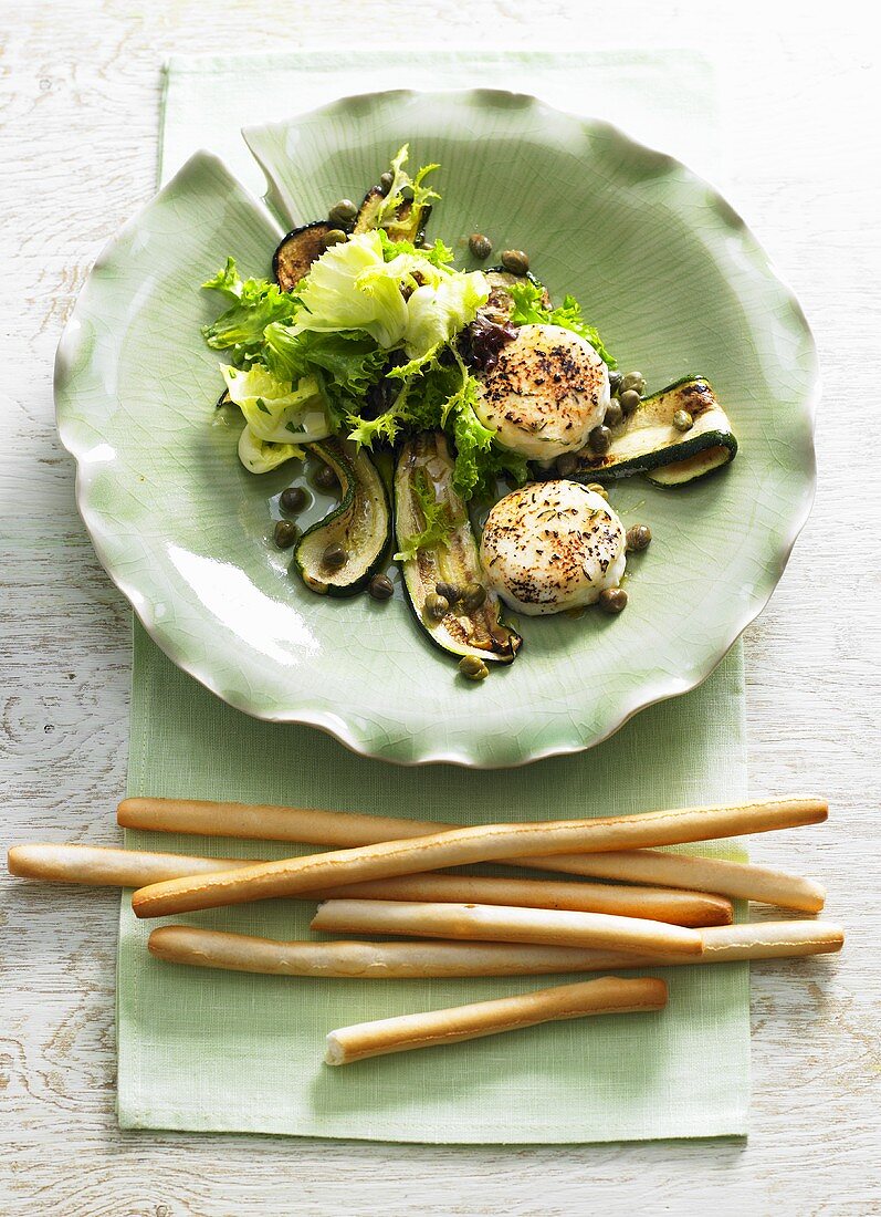 Courgette salad with capers and goats' cheese and grissini