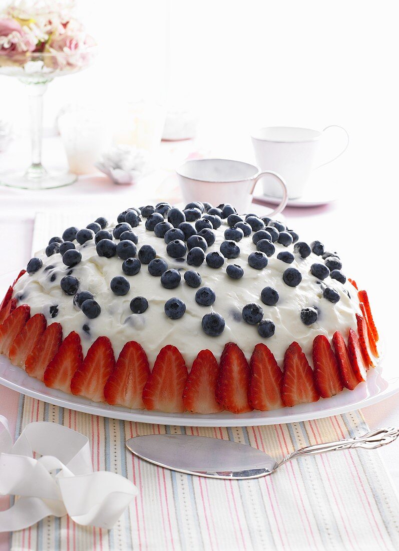 Buttermilk tart with blueberries and strawberries
