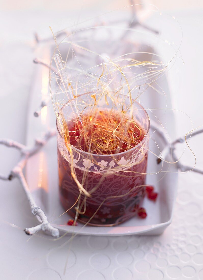 Pomegranate grog with caramel strands