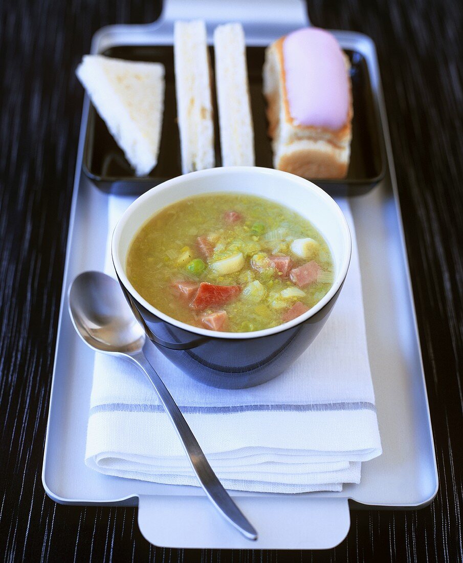 Pea soup with bacon, bread and ice cream cake