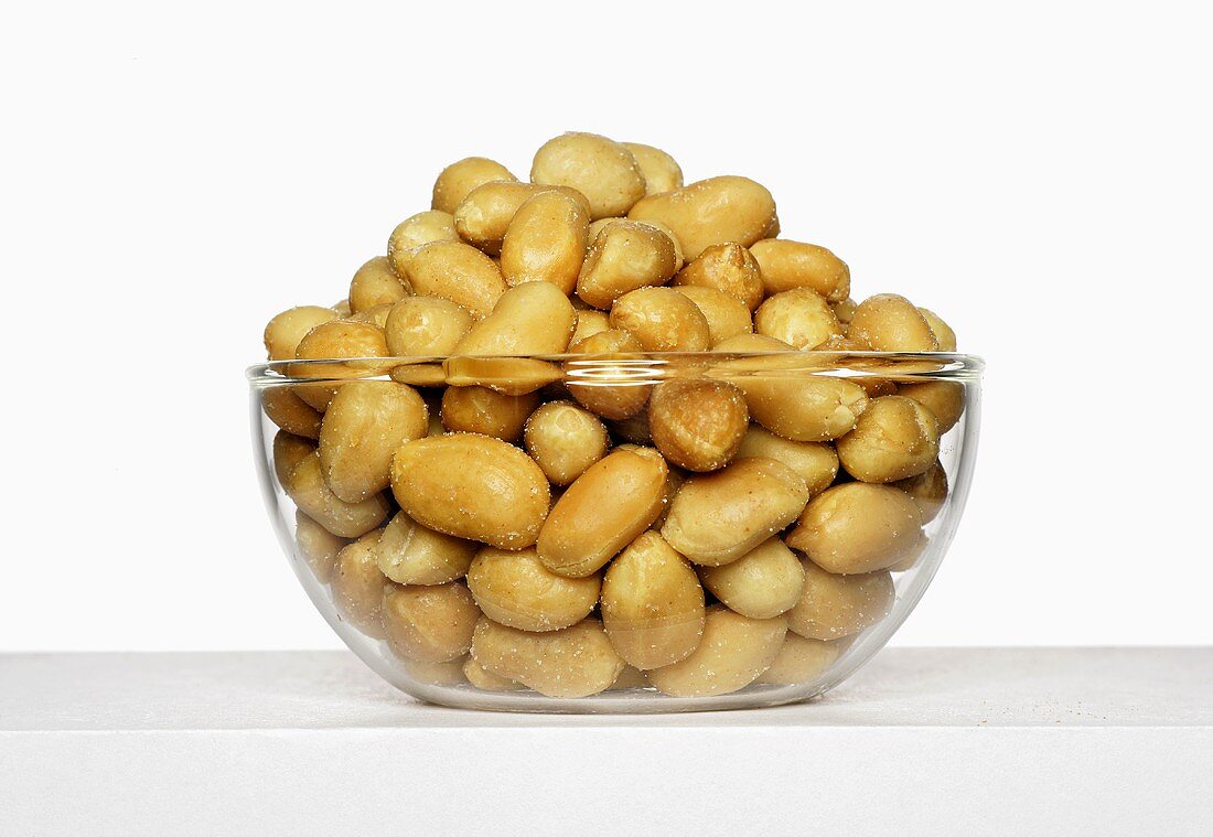 Glass bowl of peanuts