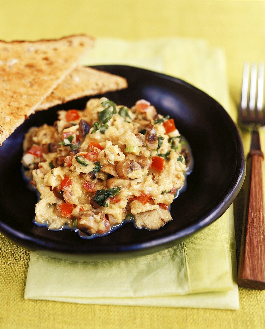 Scrambled egg with mushrooms, tomatoes, onions & coriander