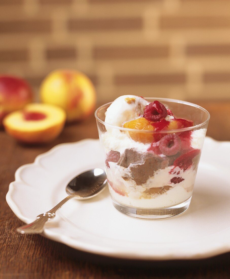Poached peach with ice cream and raspberries