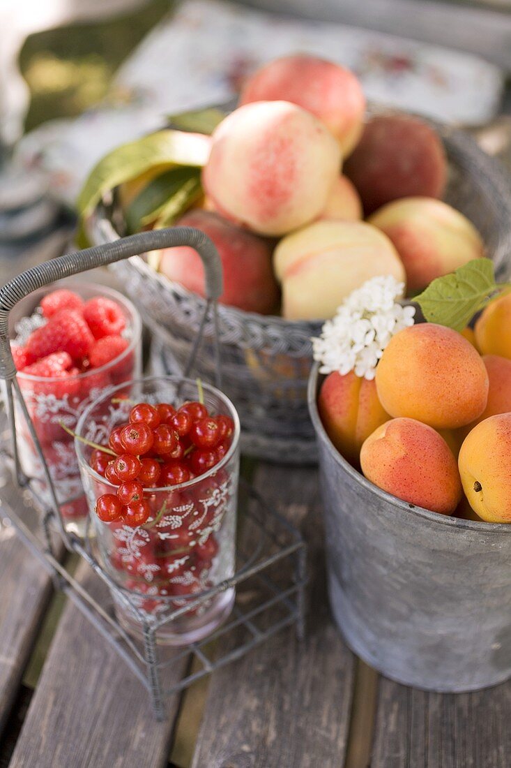 Fresh fruit and berries on a garden table