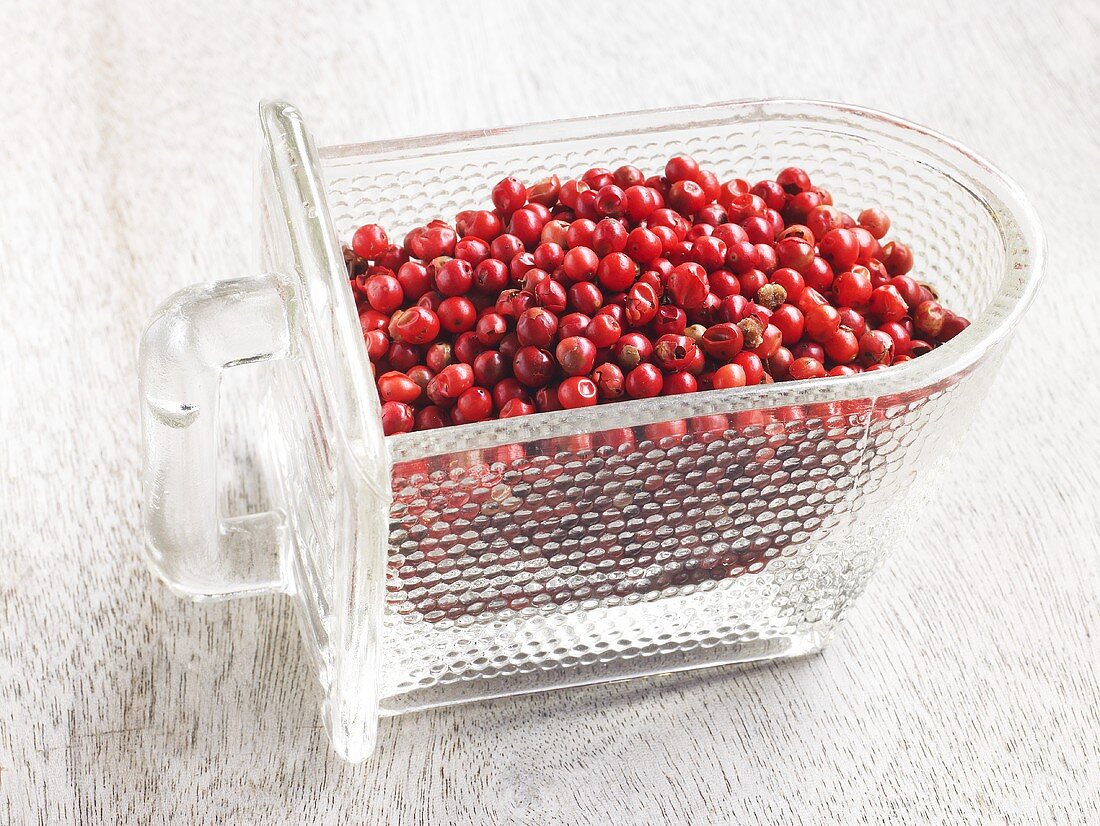 Red peppercorns in a glass container