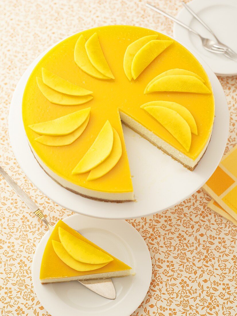 Mango cheesecake, a piece removed
