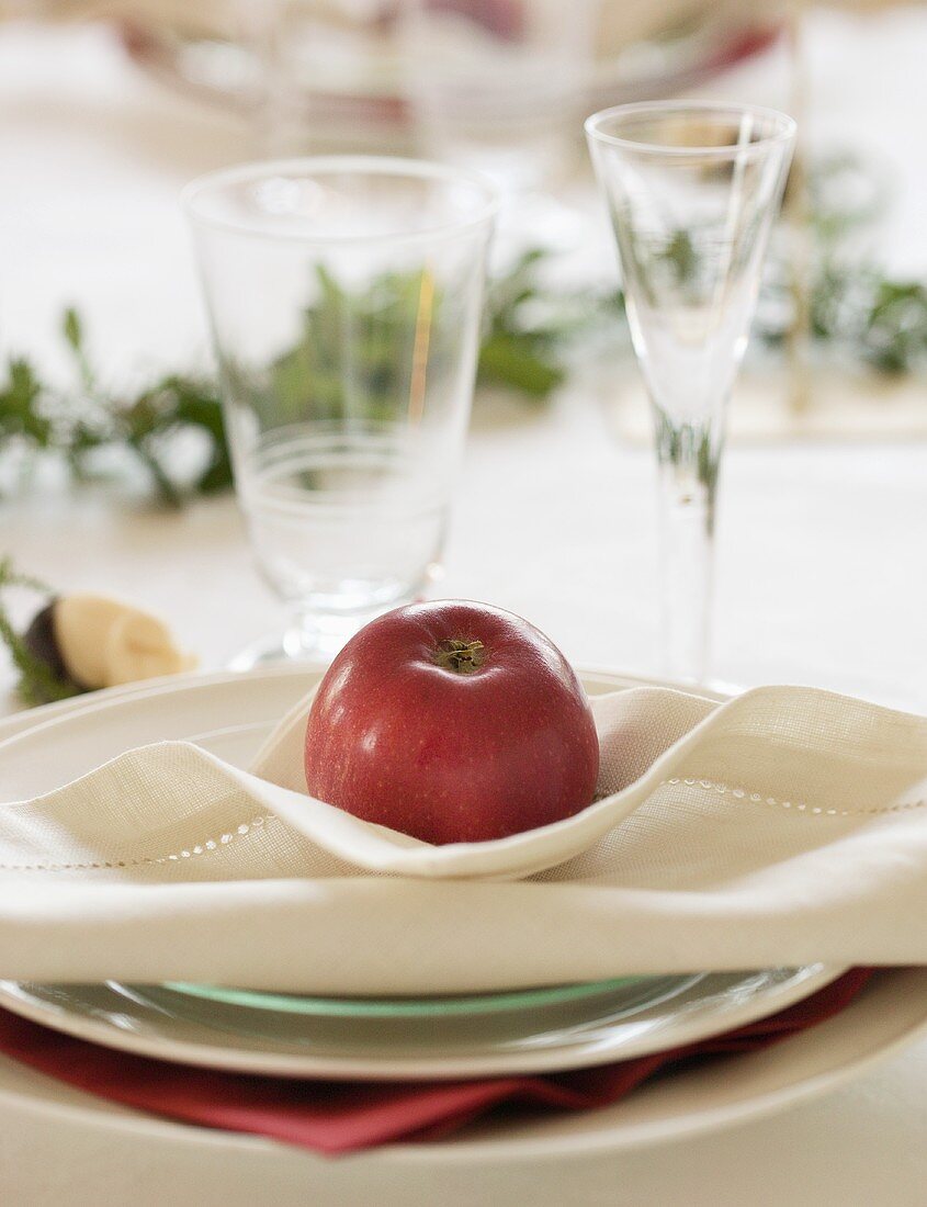 Festive place-setting with red apple (Sweden)