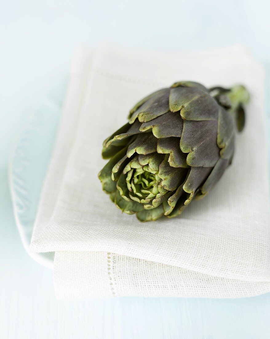 Place-setting with artichoke