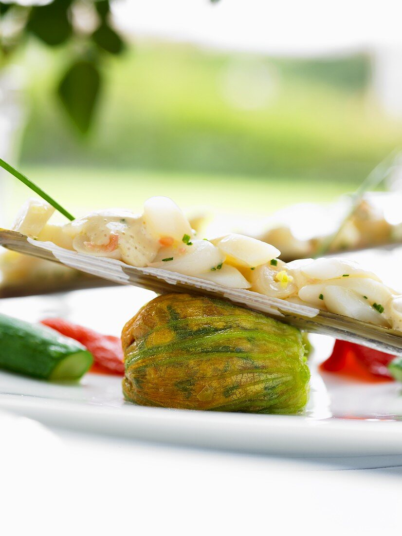 Stuffed courgette flower with accompaniments