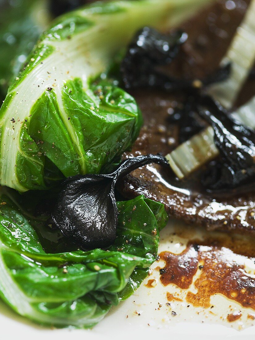 Chop with black chanterelles and Swiss chard