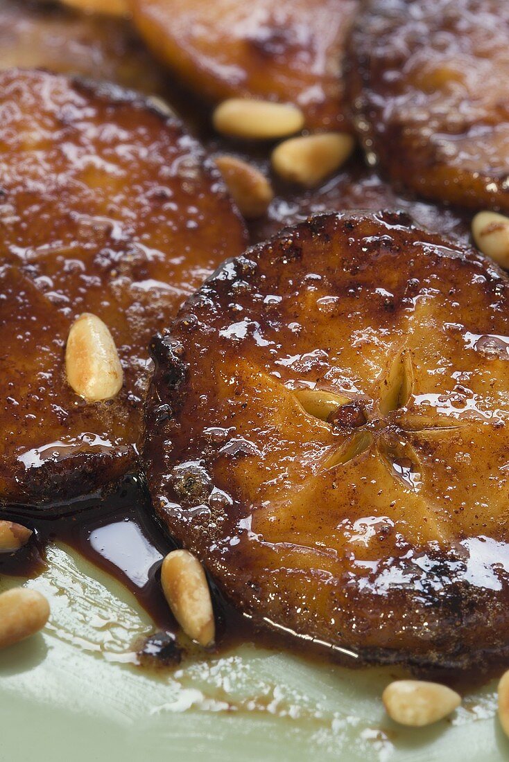 Caramelised apple slices with pine nuts