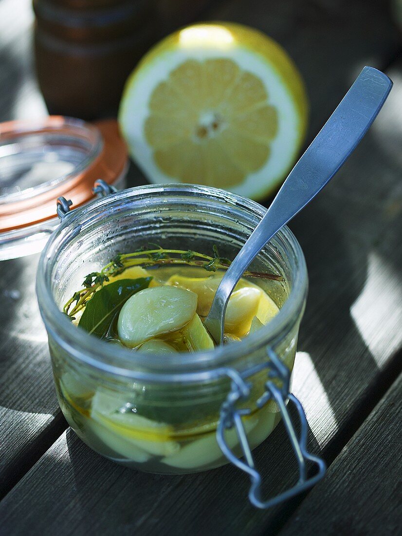 Pickled garlic with lemon and herbs
