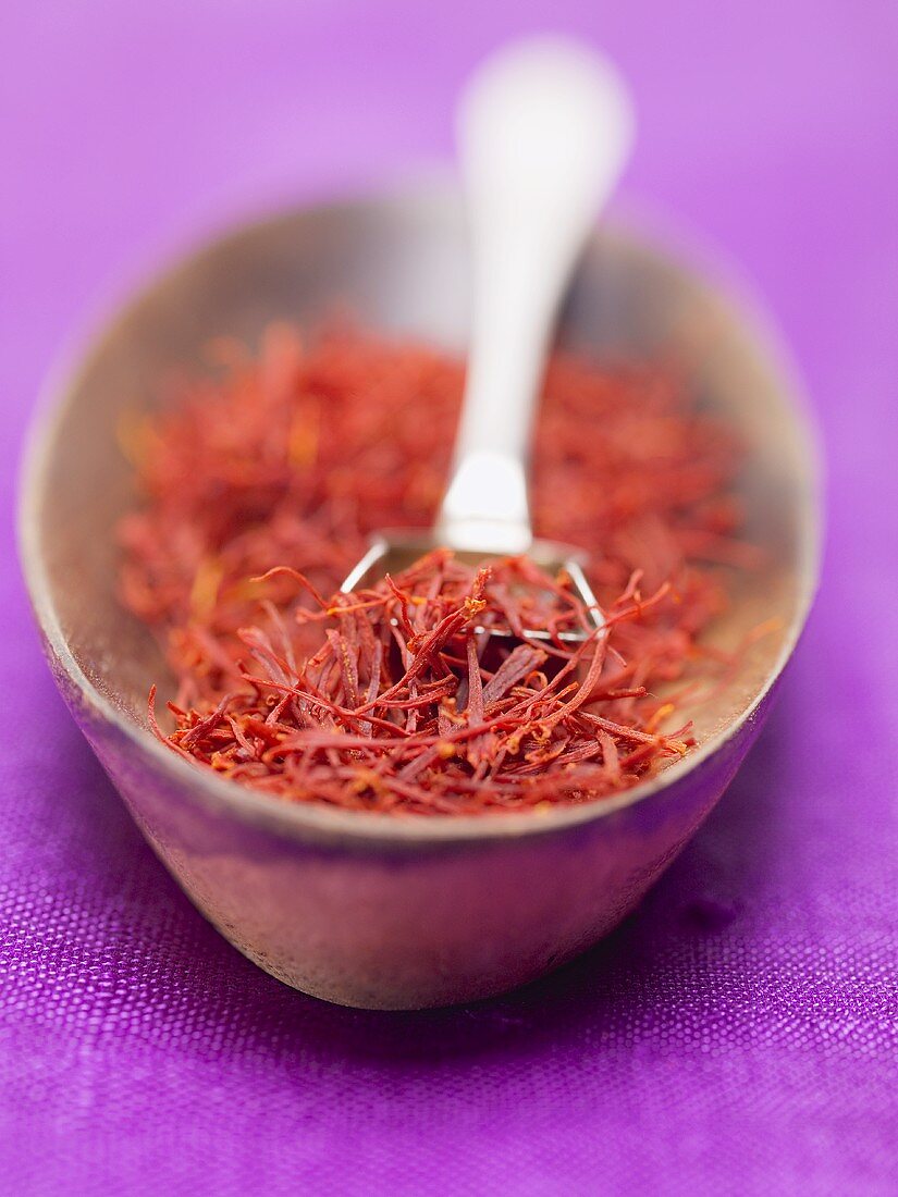 Saffron threads in small dish with spoon