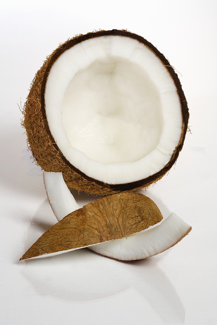 Half a coconut with two wedges of coconut