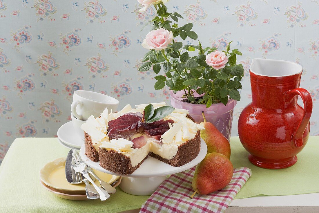Cheesecake with red wine pears and white chocolate curls