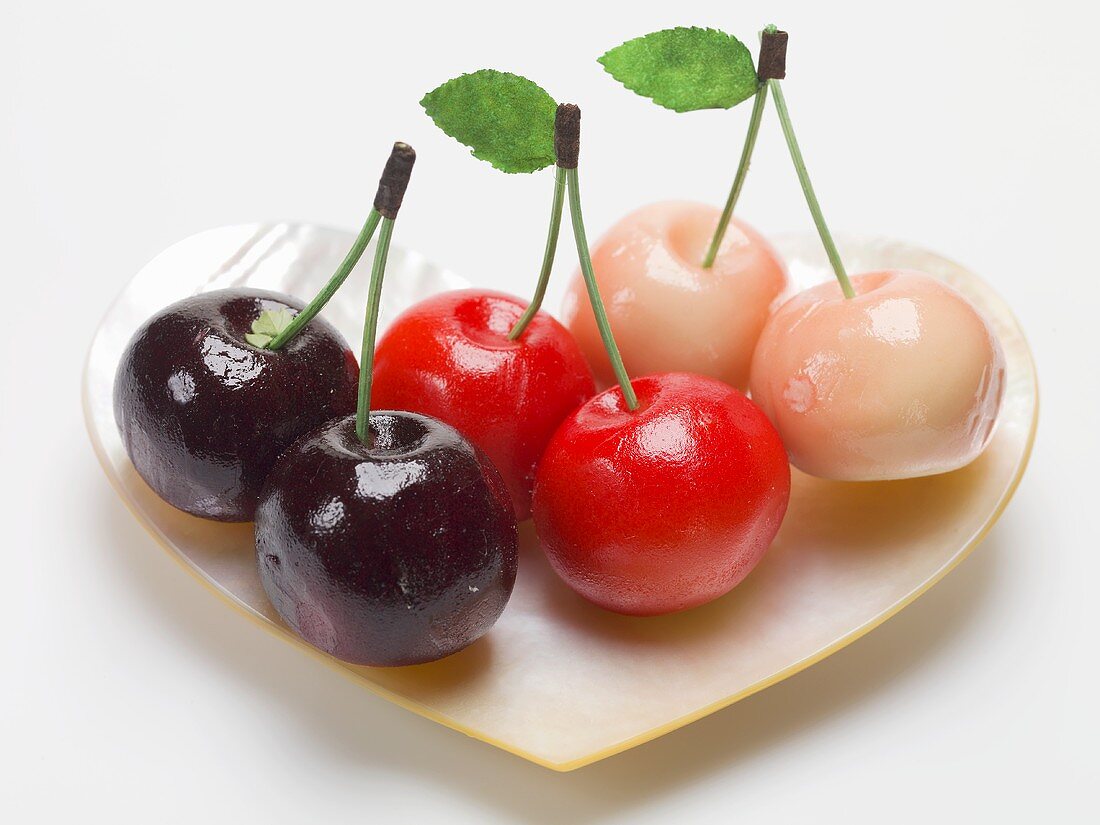 Marzipan cherries in heart-shaped mother-of-pearl dish