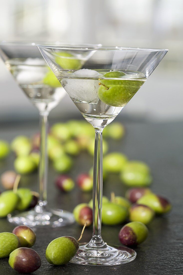 Two glasses of Martini with olives