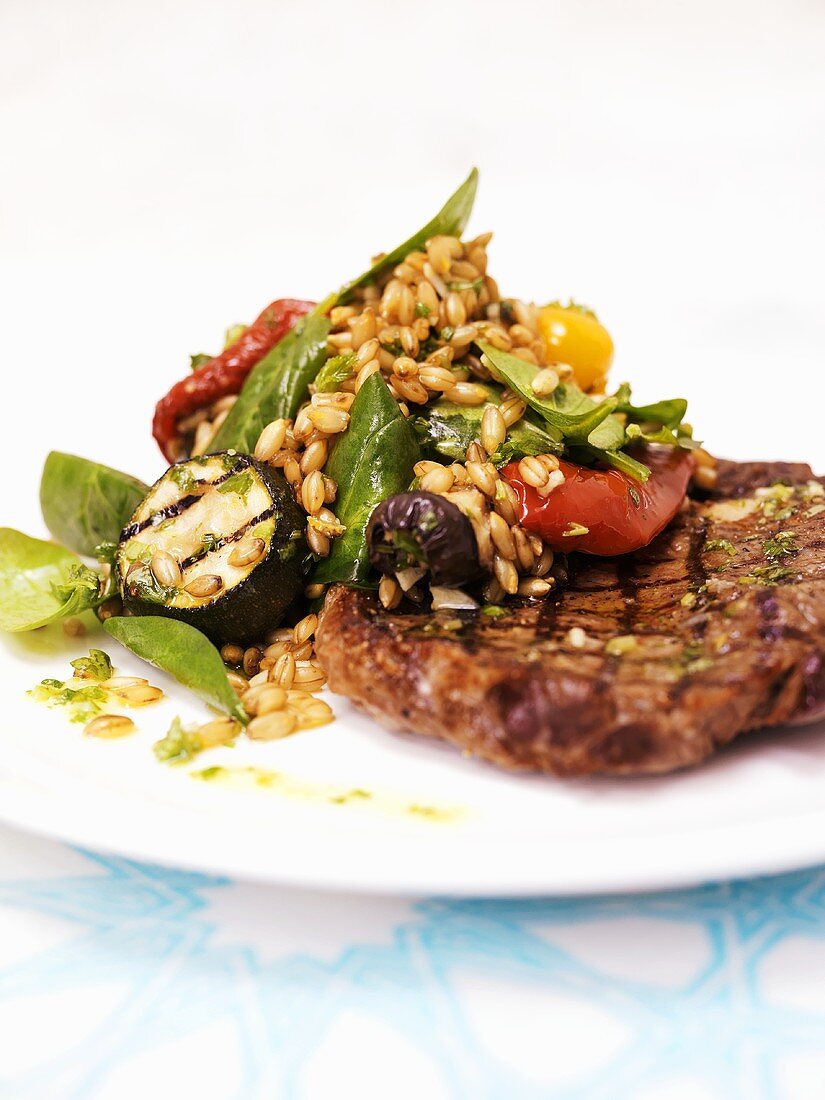 Grilled chop with wheat and vegetable salad