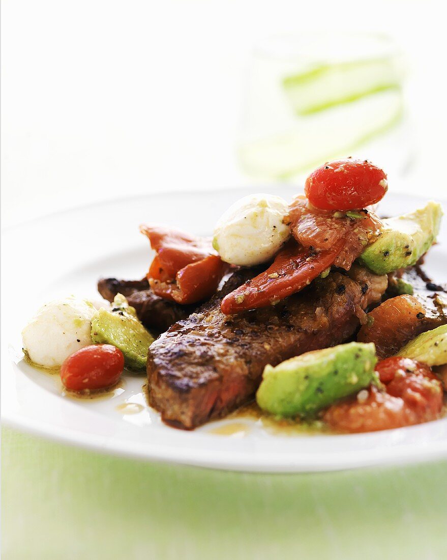 Grilled steak with vegetables, mozzarella and grapefruit