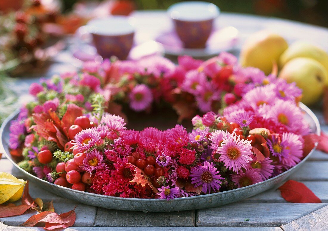 Wreath of different asters and ornamental apples