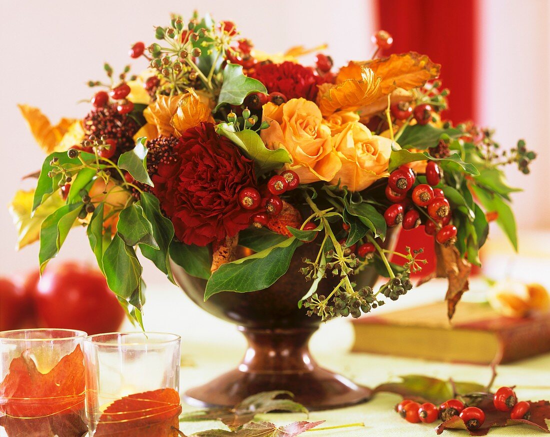 Bowl of roses and rose hips 