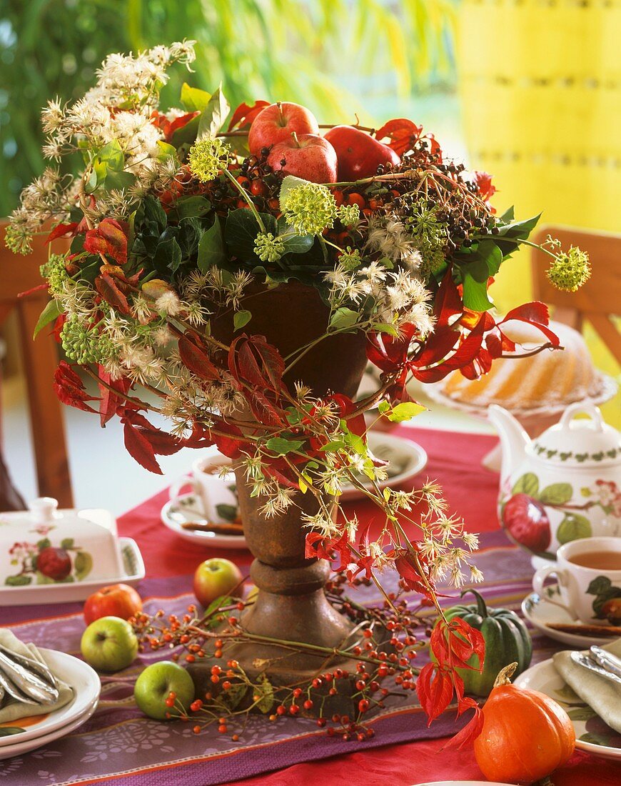 Autumnal decoration of apples, Boston ivy, Clematis and ivy