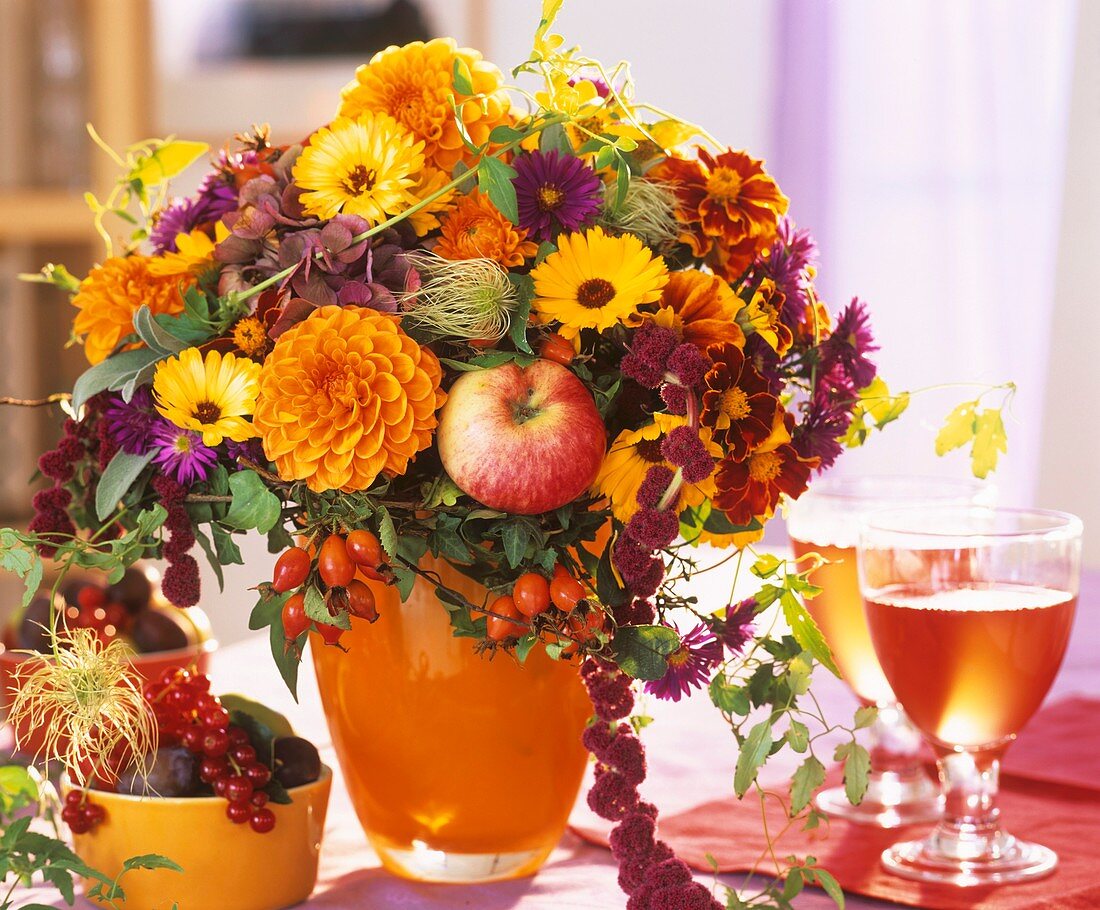 A summery arrangement with apples and berries