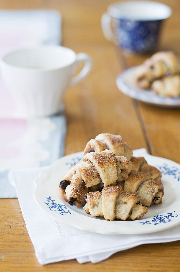 Mini-croissants filled with raisins and strawberry jam